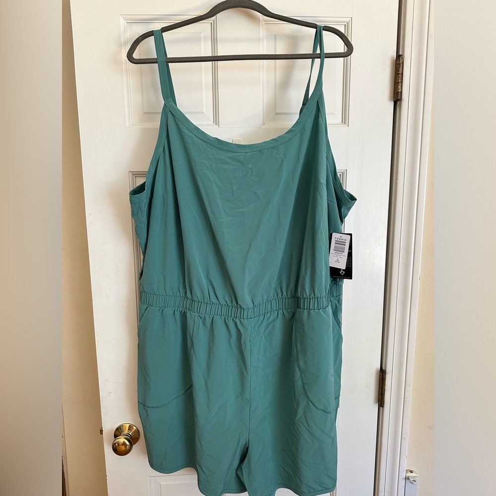 Stretch woven active romper with pockets     deep sea green. 3x
